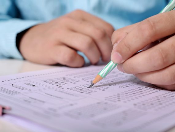 exam man holding pen, during exam